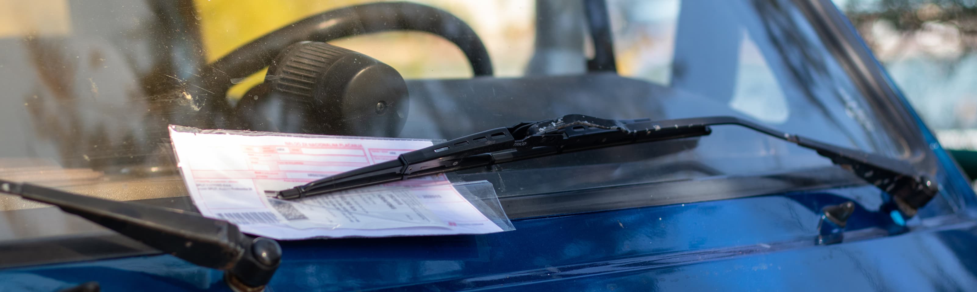 What happens if I get a parking or speeding fine in a hire car?